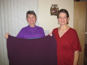 This is my mother and me holding up the size 4X pants that I no longer wear. Notice how much we look alike! 